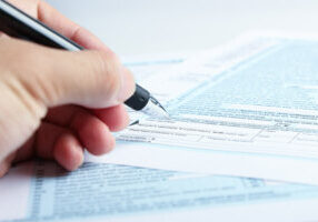 Filling out tax forms after a car accident settlement to declare income